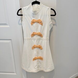 Sleeveless White Dress with Yellow Bow Accents